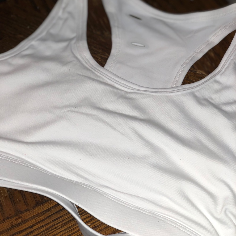 Sports bra with cell phone holder